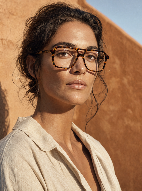 Model wearing ATLAS tortoise optical frame